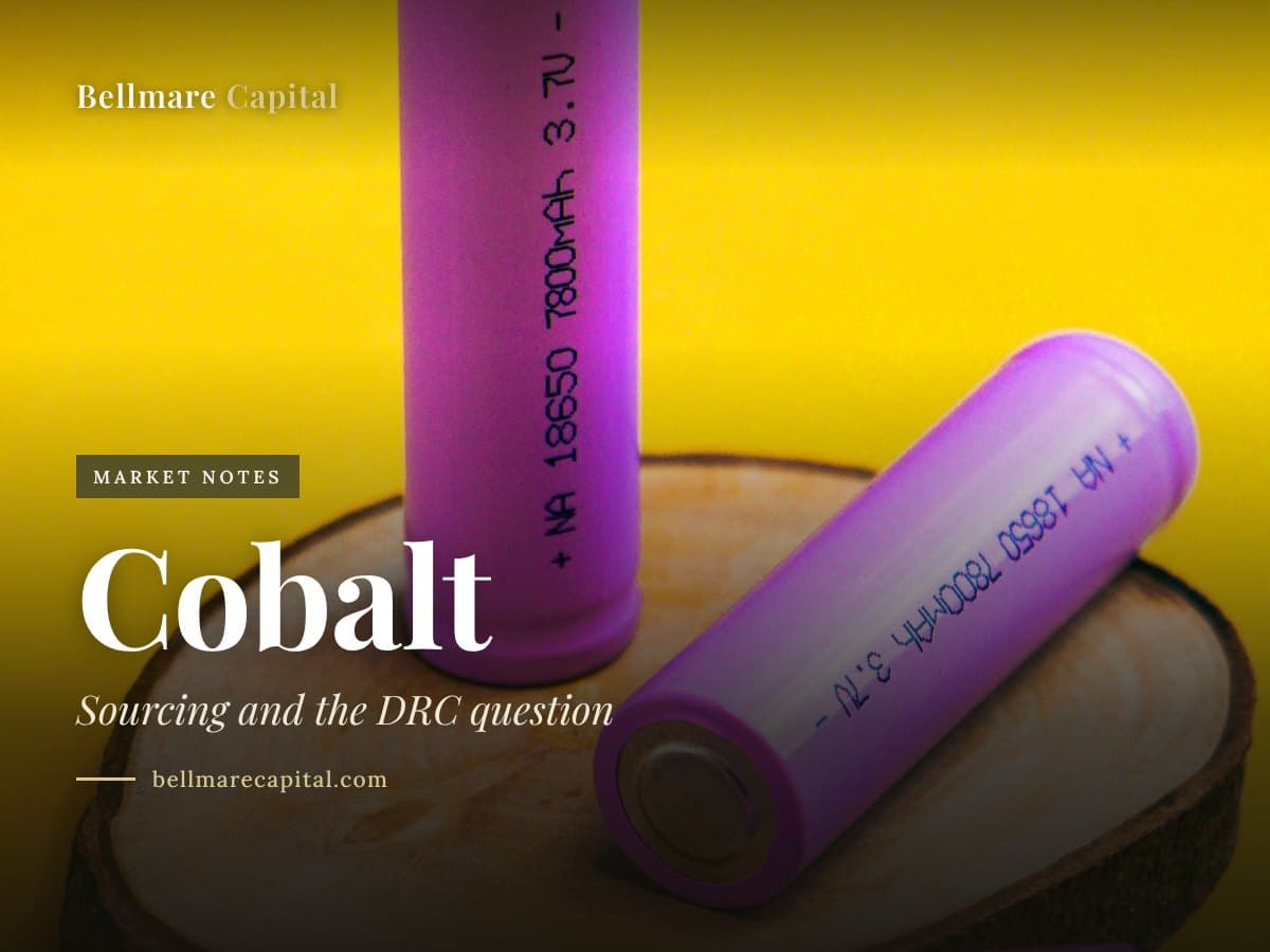 Three lithium-ion battery cells on a slice of wood against a yellow background, under the headline Cobalt
