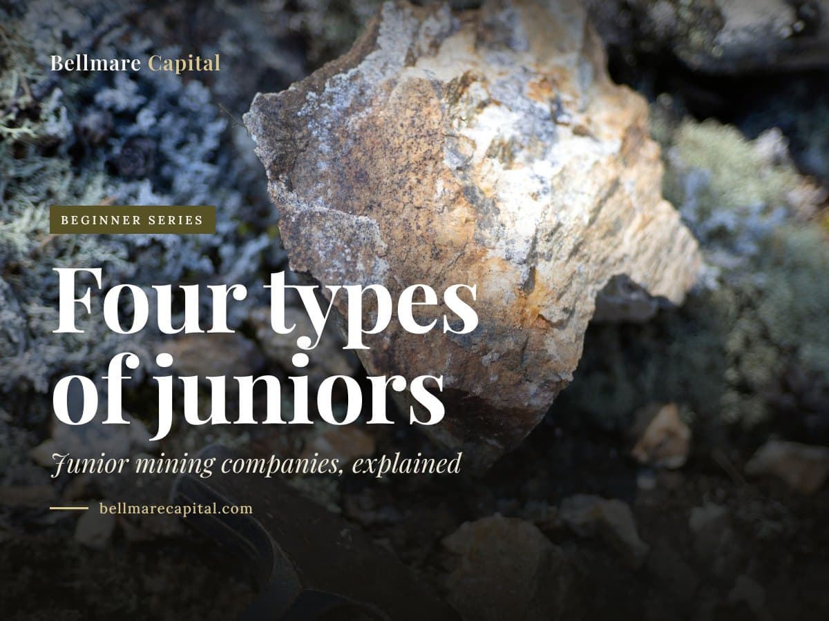 A rock hammer beside a mineral sample on rough ground, under the headline Four types of juniors
