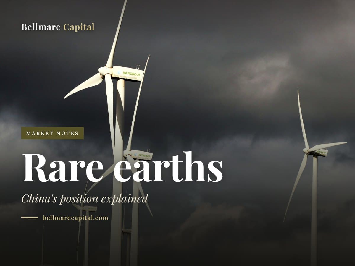 Wind turbines under a dark, cloudy sky, under the headline Rare earths