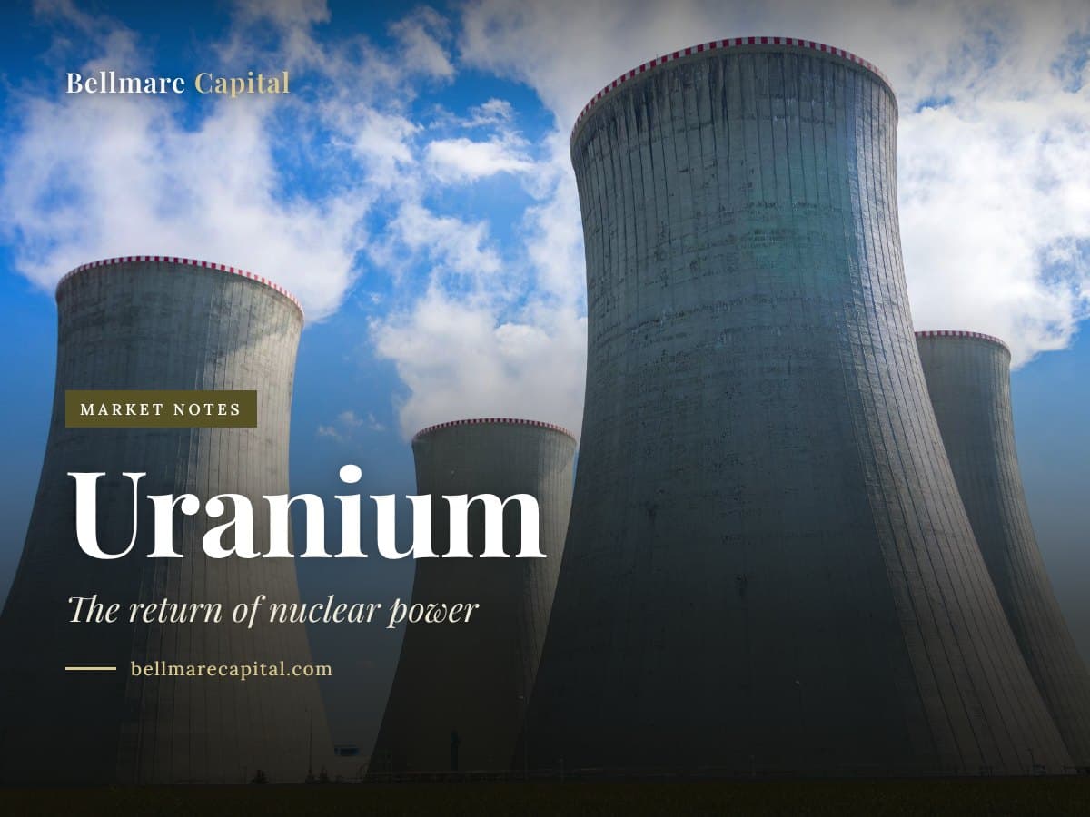 Concrete nuclear power plant cooling towers under a blue sky, under the headline Uranium
