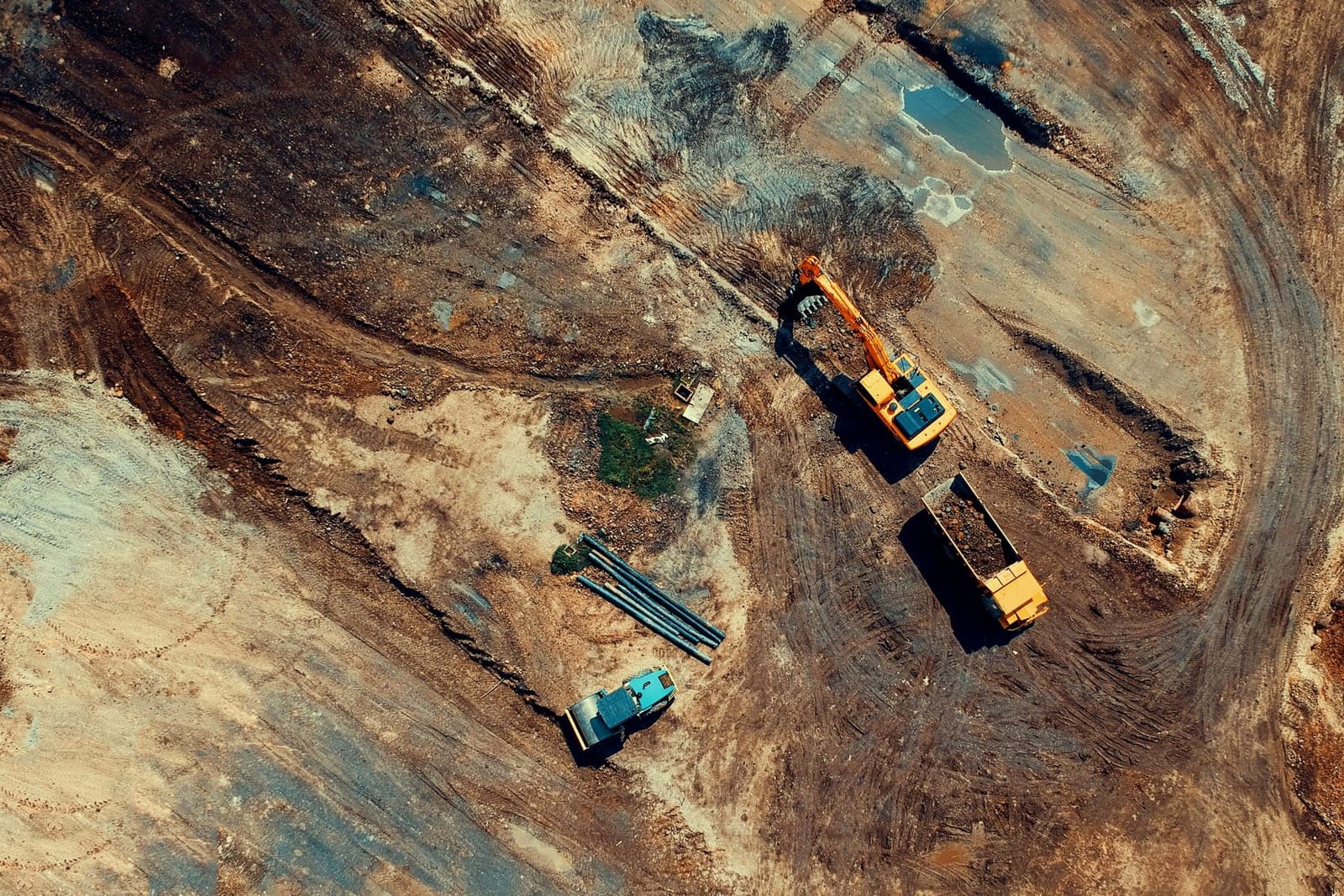 Aerial view of an excavator and haul truck on an earthworks site, under the headline Capex and opex