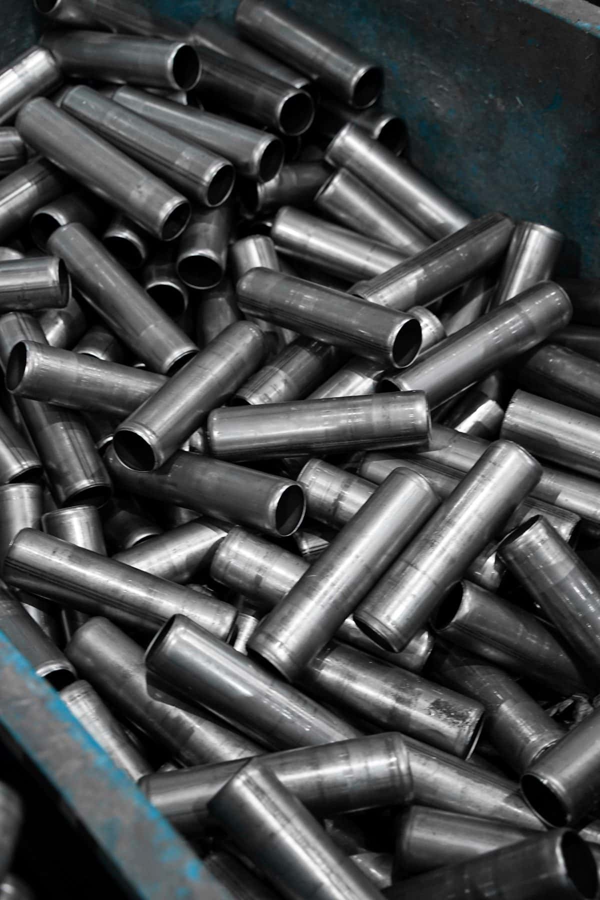 A pile of short stainless steel tubes, under the headline Nickel