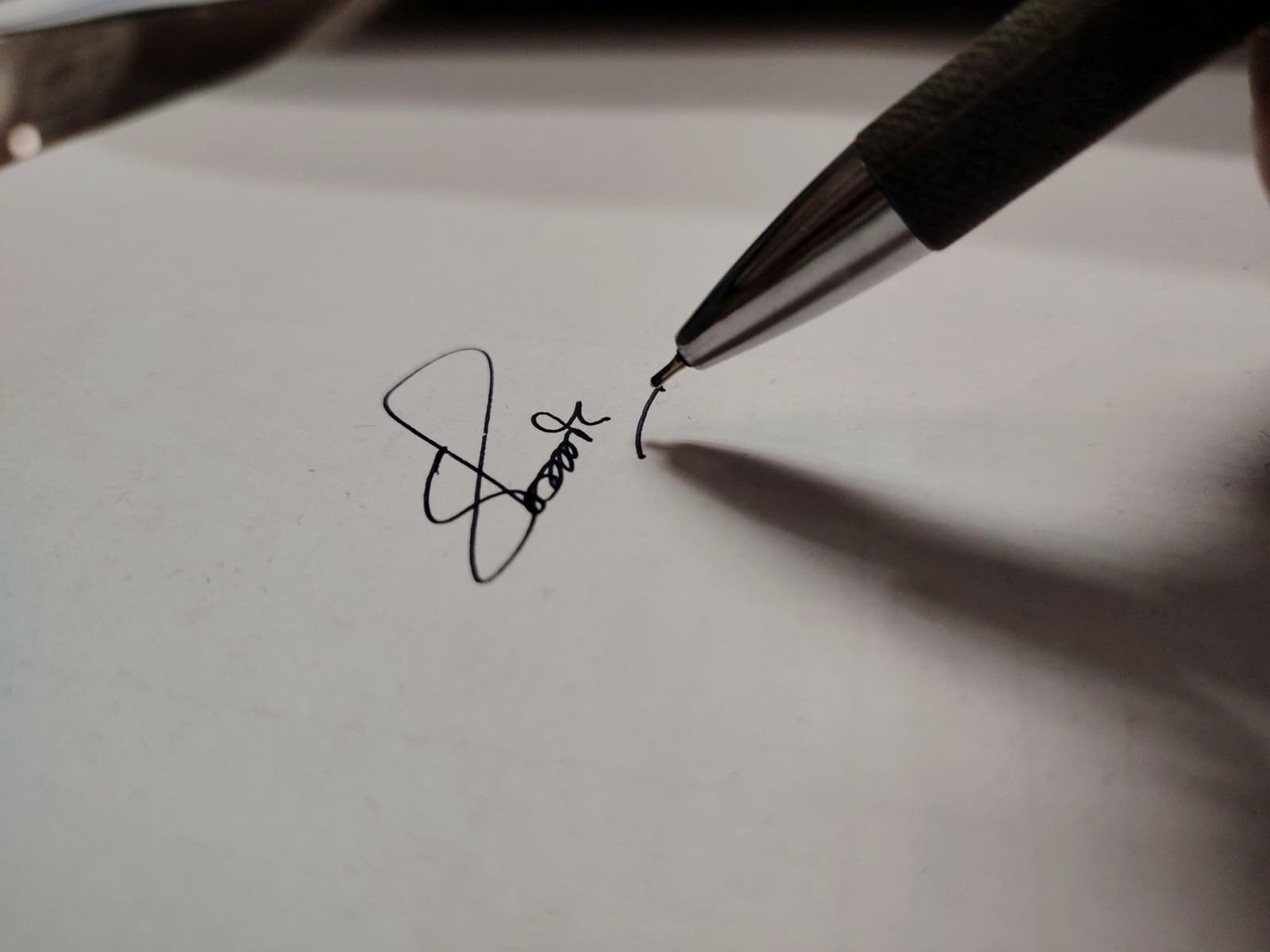 A pen finishing a signature on white paper, under the headline Insider Reports
